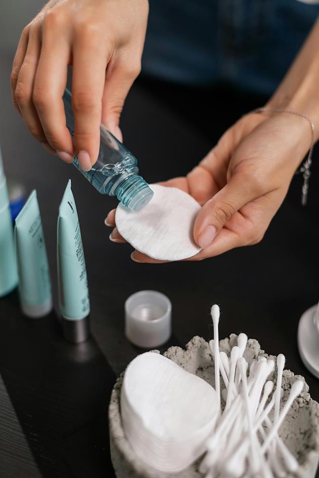 A person applying toner