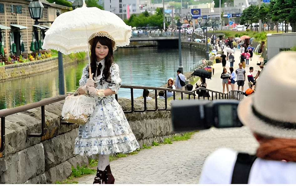 A young woman sporting Lolita fashion poses for photographs on June 29, 2014 in Otaru, Hokkaido, Japan